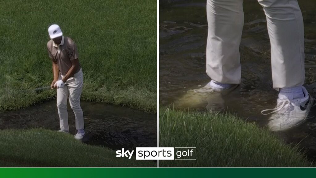 Finau plays shot with feet submerged in water hazard!